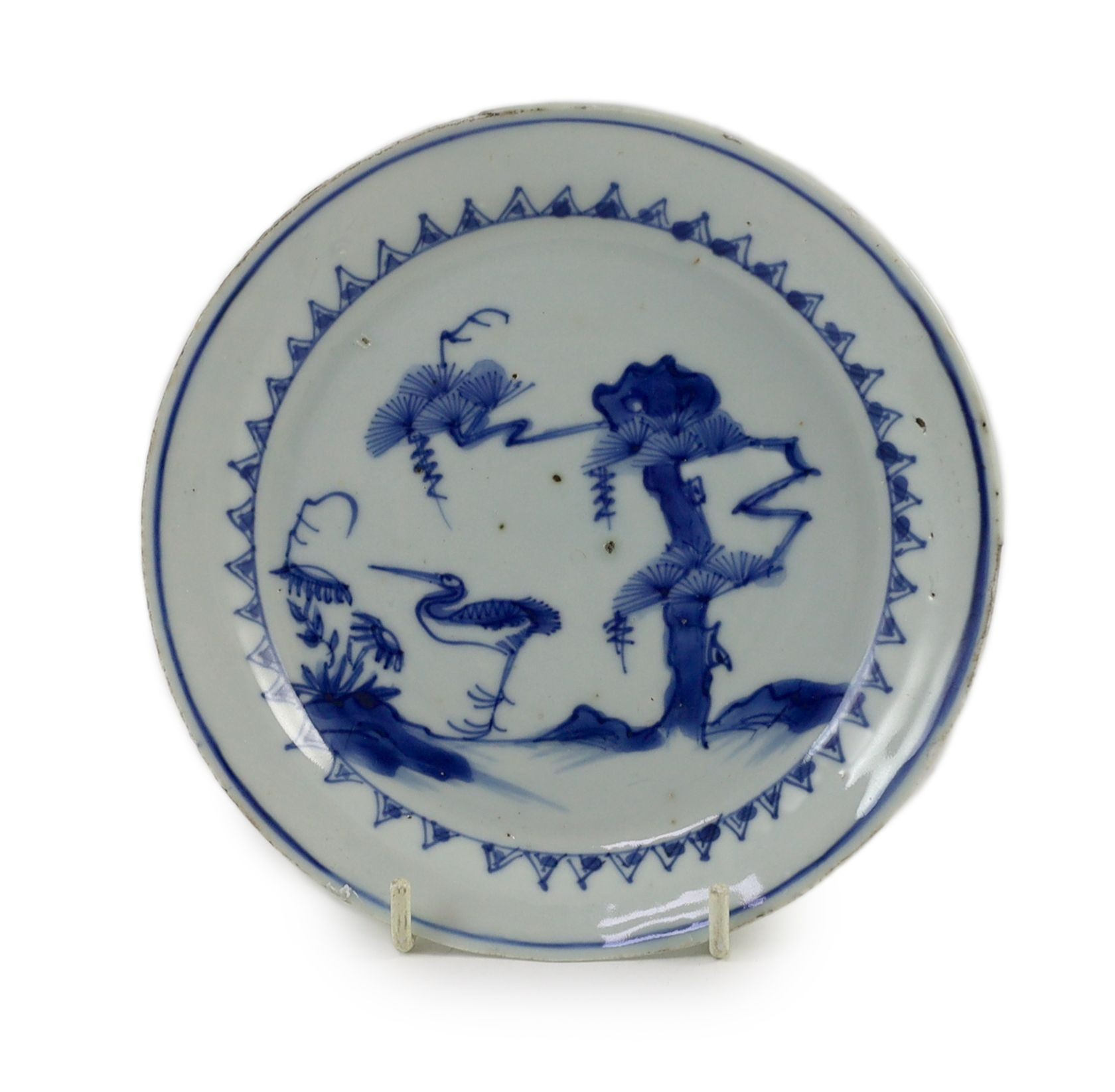 A Chinese blue and white ‘crane and pine’ dish, Transitional period, 15.7 cm diameter